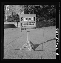 [Untitled photo, possibly related to: Washington, D.C. A sign in front of Woodrow Wilson high school on the day when number four ration books were issued]. Sourced from the Library of Congress.