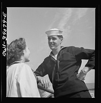 Washington, D.C. A Woodrow Wilson High School student, now in the U.S. Navy, talking to a girl. Sourced from the Library of Congress.