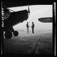 [Untitled photo, possibly related to: Frederick, Maryland. Walter Spangenberg, a student at Woodrow Wilson High School, talking to a friend at the Stevens Airport where he takes lessons]. Sourced from the Library of Congress.