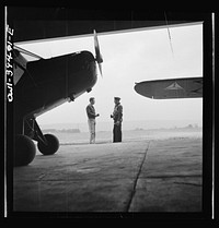 Frederick, Maryland. Walter Spangenberg, a student at Woodrow Wilson High School, talking to a friend at the Stevens Airport where he takes flying lessons. Sourced from the Library of Congress.