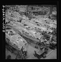 [Untitled photo, possibly related to: Boeing aircraft plant, Seattle, Washington. Production of B-17F (Flying Fortress) bombing planes. Fuselage sections]. Sourced from the Library of Congress.