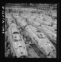 [Untitled photo, possibly related to: Boeing aircraft plant, Seattle, Washington. Production of B-17F (Flying Fortress) bombing planes. Fuselage sections]. Sourced from the Library of Congress.