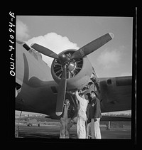 [Untitled photo, possibly related to: Boeing aircraft plant, Seattle, Washington. Production of B-17F (Flying Fortress) bombing planes. Lubricating and servicing a new B-17F (Flying Fortress) bomber]. Sourced from the Library of Congress.