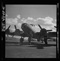 [Untitled photo, possibly related to: Production. B-17 heavy bomber. An Army sentry guards new B-17F (Flying Fortress) bombers at the airfield of Boeing's Seattle plant. The ship will be delivered to the Army and the Navy after they have successfully undergone flight tests. The Flying Fortress has performed with great credit in the South Pacific, over Germany and elsewhere. It is a four-engine heavy bomber capable of flying at high altitudes]. Sourced from the Library of Congress.