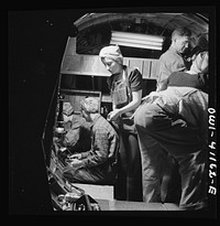 Boeing aircraft plant, Seattle, Washington. Production of B-7 F (Flying Fortress) bombing planes. A team of workers completing assembly and fitting operations on the interior of a fuselage section. Sourced from the Library of Congress.