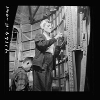 Boeing aircraft plant, Seattle, Washington. Production of B-17F (Flying Fortress) bombing planes. Workers completing a fuselage framework. Sourced from the Library of Congress.