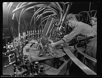 Boeing aircraft plant, Seattle, Washington. Production of B-17 (Flying Fortress) bombing planes. Octupus punching machine working on parts for B-17 (Flying Fortress) bombers. Sourced from the Library of Congress.