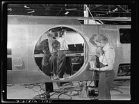 [Untitled photo, possibly related to: Boeing aircraft plant, Seattle, Washington. Production of B-17F (Flying Fortress) bombing planes. Fuselage sections.]. Sourced from the Library of Congress.