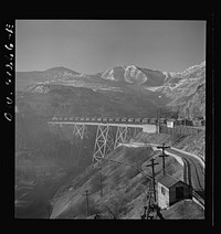 [Untitled photo, possibly related to: Bingham Canyon, Utah. Open-pit workings of the Utah Copper Company, showing loaded ore trains in the foreground]. Sourced from the Library of Congress.