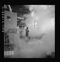 [Untitled photo, possibly related to: Phelps Dodge refining company, El Paso, Texas. Sheets of pure copper, which had been formed by electrolysis in huge tanks, being melted now and cast into ingots]. Sourced from the Library of Congress.