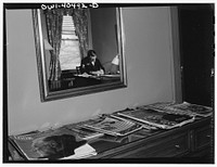 Washington, D.C. There are magazines, writing materials, and soft chairs in the small lounge rooms at the United Nations service center. Sourced from the Library of Congress.