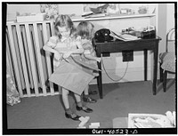 Washington, D.C. Children playing in the nursery at the United Nations service center while their mothers make arrangements for continuing their journey. Sourced from the Library of Congress.