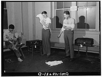 Washington, D.C. Without engaging a hotel room, traveling servicemen may take a shower, shave, and wash and iron clothes at the United Nations service center. Sourced from the Library of Congress.