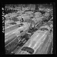 [Untitled photo, possibly related to: Boeing aircraft plant, Seattle, Washington. Production of B-17F (Flying Fortress) bombing planes. Fuselage sections]. Sourced from the Library of Congress.