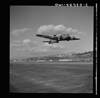 [Untitled photo, possibly related to: Production. B-17 heavy bomber. Another mighty B-17F (Flying Fortress) bomber sets out on a test flight from the airfield of Boeing's Seattle plant. The Flying Fortress has performed with great credit in the South Pacific, over Germany and elsewhere. It is a four-engine heavy bomber capable of flying at high altitudes]. Sourced from the Library of Congress.