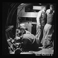 [Untitled photo, possibly related to: Boeing aircraft plant, Seattle, Washington. Production of B-17F (Flying Fortress) bombing planes. A crew working in a nearly completed fuselage section]. Sourced from the Library of Congress.