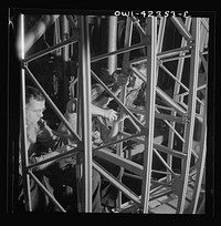 [Untitled photo, possibly related to: Boeing aircraft plant, Seattle, Washington. Production of B-17F (Flying Fortress) bombing planes. Women working on the fuselage framework]. Sourced from the Library of Congress.