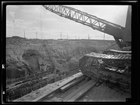 Columbia Steel Company at Geneva, Utah. Constructing a water intake tunnel for a new steel plant which will make important additions to the vast amount of steel needed for the war effort. Sourced from the Library of Congress.