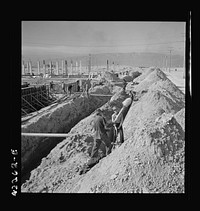[Untitled photo, possibly related to: Columbia Steel Company at Geneva, Utah. Steel and concrete go into place rapidly as a new steel mill takes form. The new plant will make important additions to the vast amount of steel needed for the war effort]. Sourced from the Library of Congress.
