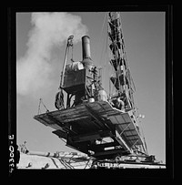 [Untitled photo, possibly related to: Columbia Steel Company at Geneva, Utah. Driving piles for the foundations for a new steel mill, which will make important additions to the vast amount of steel needed for the war effort]. Sourced from the Library of Congress.