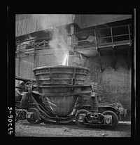 [Untitled photo, possibly related to: Columbia Steel Company at Ironton, Utah. Tapping a blast furnace for an iron cast]. Sourced from the Library of Congress.