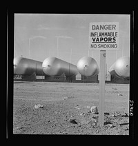 [Untitled photo, possibly related to: Las Vegas, Nevada. Like a row of dirigible balloons, the propane gas storage tanks rest upon the floor of the southern Nevada desert at Basic Magnesium's giant plant, where magnesium is produced]. Sourced from the Library of Congress.