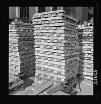 [Untitled photo, possibly related to: Las Vegas, Nevada. Stacks of magnesium ingots ready for war use by manufacturers of aircraft and tracer bullets, produced by the Basic Magnesium Incorporated plant in the southern Nevada desert]. Sourced from the Library of Congress.