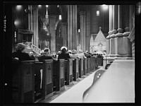 New York, New York. Seven o'clock mass on D-day in the Lady Chapel, Saint Patrick's Cathedral. Sourced from the Library of Congress.