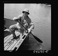 [Untitled photo, possibly related to: Fort Belvoir, Virginia. Four soldiers of the United States Army Engineer Corps paddling a barge, probably for the construction of a bridge]. Sourced from the Library of Congress.