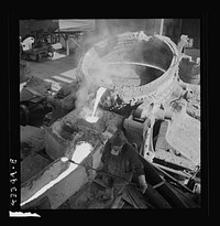 Columbia Steel Company at Ironton, Utah. Pouring a heat of iron. Sourced from the Library of Congress.