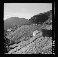 [Untitled photo, possibly related to: Kingman (vicinity), Arizona. A general view showing a huge waste pile and beyond it the recovery plant where tungsten ore is processed. The ore is mined in the nearby Boriana workings]. Sourced from the Library of Congress.