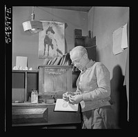 [Untitled photo, possibly related to: Kingman (vicinity), Arizona. Mr. Relling, in the laboratory, analyzing tungsten ore and concentrates in a plant near the Boriana mines where the chromium-like metallic elements are obtained]. Sourced from the Library of Congress.
