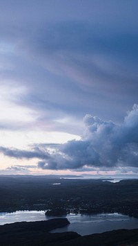 Nature phone wallpaper background, cloudy sky over a city of Isle of Skye, Scotland