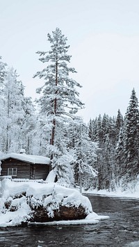 Winter phone wallpaper background, Snow-covered hut by river in the Oulanka National Park, Finland