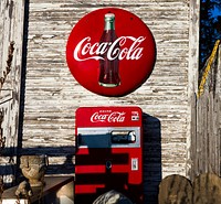 A vintage Coca-Cola sign and Coke machine outside the John E. Piedt & Sons Antique Store in Benton Harbor, Michigan. Original image from Carol M. Highsmith’s America, Library of Congress collection. Digitally enhanced by rawpixel.