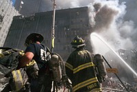 Rescue officers ceasing the fire during the aftermath of the September 11 terrorist attack on the World Trade Center, New York City. Courtesy of the Prints and Photographs Division, Library of Congress. Digitally enhanced by rawpixel.