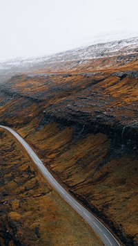 Nature mobile wallpaper background, scenic freeway by the lake on Faroe Islands