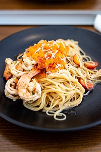 Prawn linguine angel hair spaghetti on a plate