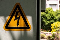 Electrocution warning yellow triangle sign