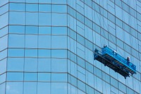 Window cleaners working on a high rise building in Bangkok