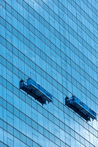 Window cleaners working on a high rise building in Bangkok