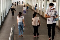 Commuters on skywalk during COVID-19 situation. BANGKOK, THAILAND, 16 APRIL 2021