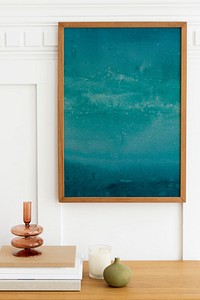 Ombre blue ocean picture frame over a wooden sideboard table
