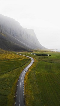 Adventure phone wallpaper background, SUV car driving in the countryside drone shot