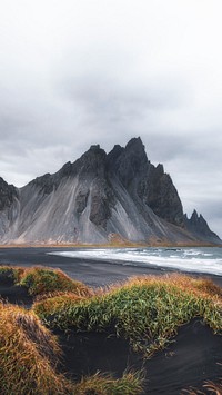 Nature mobile wallpaper background, cloudy black sand beach in Iceland