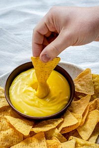 Tex mex corn tortilla chips with cheddar cheese dip