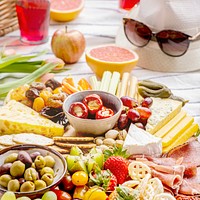 Charcuterie board with cold cuts, fresh fruits and cheese, summer picnic
