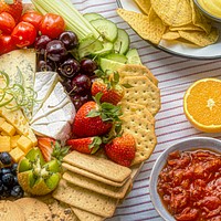 Snack board with cheese and crackers close up