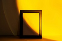 Blank picture frame with yellow sunset projector lamp