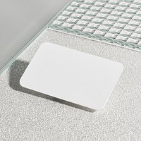 Blank white card on pattern glass